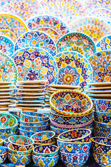 Colorful pottery dishes sold in Dubai souk, Unied Arab Emirates