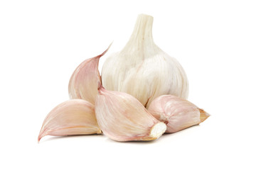 Collection of raw garlic - head and segments isolated on a white background in close-up