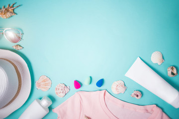 Beach accessories on blue background