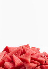 Pile of ripe fresh watermelon pieces, cut into small triangles