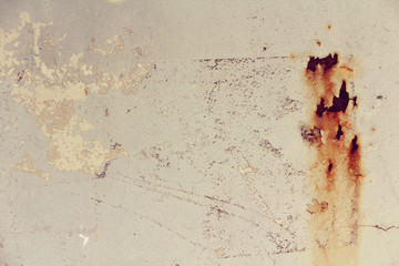 Dirty white wall with rust stains. Old paint.