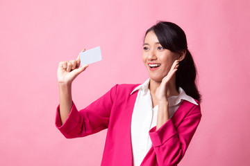 Young Asian woman happy with  blank card.