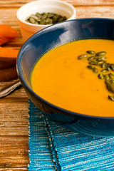 Creamy pumpkin soup garnished with pumpkin seeds