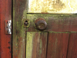 Old shabby rustic wooden door shut