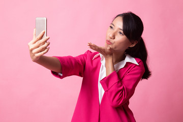 Young Asian woman with mobile phone.