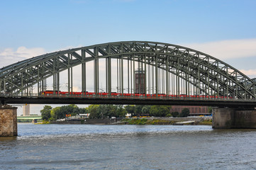 Fototapeta na wymiar Train crossing the Rhine on the Bridge Hohenzollern, Cologne, Germany