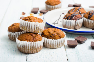 chocolate cupcakes, old white wooden table