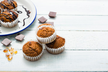 chocolate cupcakes, old white wooden table