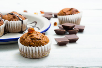 chocolate cupcakes, old white wooden table