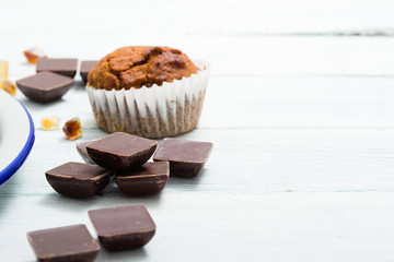 chocolate cupcakes, old white wooden table