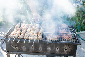 Barbecue on the grill. Cooking meat on the grill.