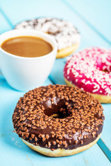 Sweet donuts on black stone table