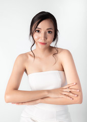 Portrait of Attractive Beauty Asian Women in Fashion Posing with Smiling Face Wearing White Dress on White Background for Cosmetic or Health Media