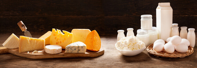 various types of dairy products on rustic wooden table