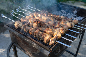 Barbecue on the grill. Cooking meat on the grill.