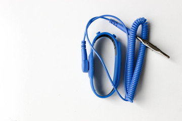 Blue antistatic bracelet device on white background