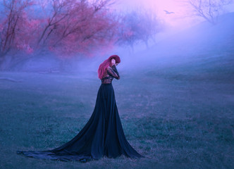 Mustery gothic woman sad lady in black dress unhappy walking in deep forest fog autumn tree forest....