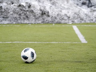 Soccer ball on football playfield