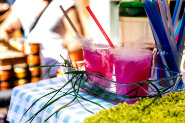 Cocktail with steam, drink with nitrogen on the summer