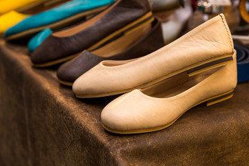 Fototapeta na wymiar Fashion stylish casual leather shoes in the showcase