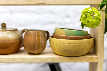 Handmade ceramics on the market. Mugs, plates