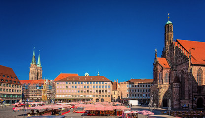 Fototapeta na wymiar Market stalls on the market square of the Franconian city of Nuremberg in Germany