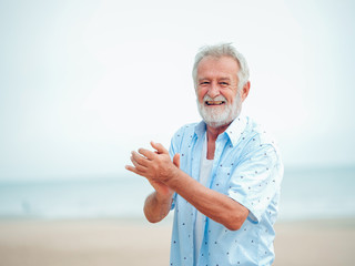 Portrait of Senior retirement Man on the beach