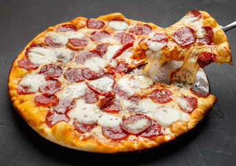 Taking Piece Of Melting Pepperoni Pizza, Closeup