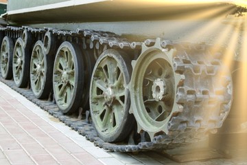 Military stile. Detail shot with old tank tracks and wheels