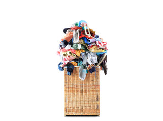 Beige straw basket full of dirty Laundry