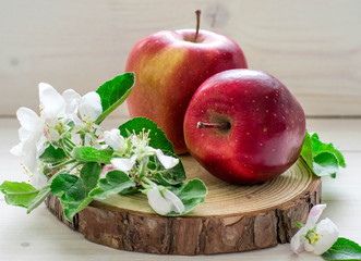 two red apple  wooden background