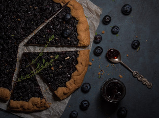 blueberry pie tart dark photo top view