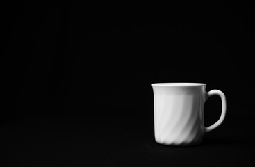 Realistic white cup isolated on dark background.  White ceramic cup with saucer. Cup of tea.