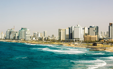 Tel Aviv cityscape capital of Israel panoramic photography format with Mediterranean sea coast line beach and skyscrapers building along waterfront, summer vacation destination place