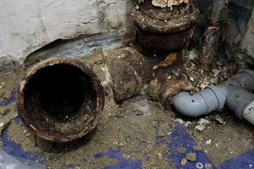 Sewage in the apartment. System of sanitary pipes in the old house. The concept of repair and replacement of iron pipes for plastic.