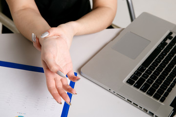 Female feeling pain in wrist after working on laptop