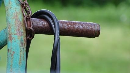 Rusted bar with cable