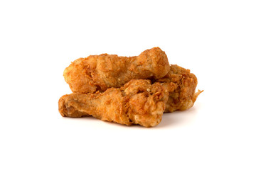 Fried legs on a white background. Chicken legs deep fried close-up..