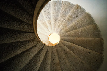 Padula, Salerno, Campania, Italy - April 21, 2019: Detail of the helical stone staircase leading to the library of the Certosa di San Lorenzo