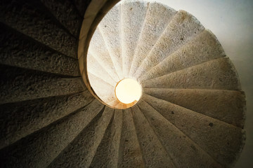 Padula, Salerno, Campania, Italy - April 21, 2019: Detail of the helical stone staircase leading to...