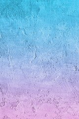 Rough blue and pink color textured concrete background.