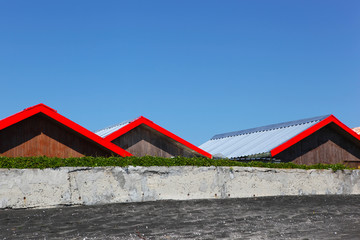 Red Roofs On Blue Sky Background