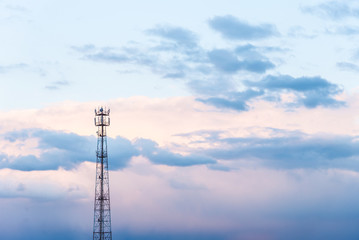 Abstract telecommunication tower Antenna and satellite dish at sunset sky clouds backgrounds.