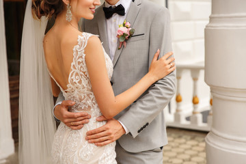 Wedding couple. Bride and groom embracing at wedding day