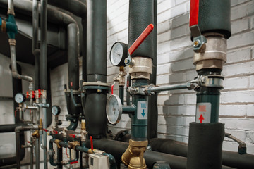 House heating system with many steel pipes, manometers and metal tubes