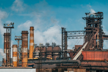 Fototapeta na wymiar Metallurgical factory with chimneys and smog. Industrial plant for steelworks, ironworks or metalworks as heavy industry background