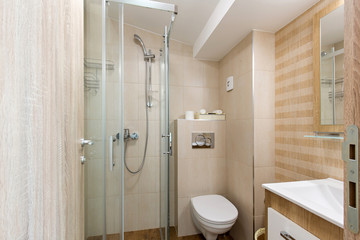 Hotel bathroom interior with shower cabin