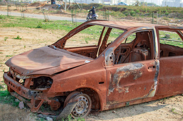 Burned car with burnt paint and empty vehicle