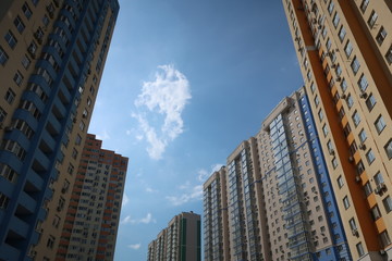 Fototapeta na wymiar city sky houses clouds windows much background texture