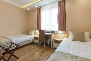 Fototapeta na wymiar Hotel room interior,double bed beige bedroom